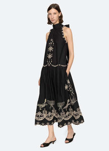The Kingsley embroidered tank dress by SEA NY showcases intricate embroidery throughout its design, offering a refined and elegant appeal. It features a high neckline that adds a sophisticated touch, complemented by a delicate back bow tie for adjustable fit and added charm. The scalloped hemline enhances the dress's feminine silhouette, making it an exceptional choice for those seeking a polished yet distinctive look.