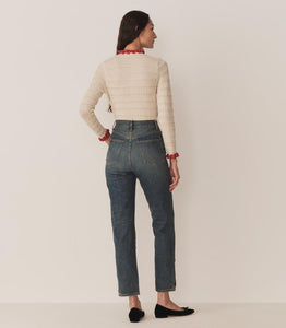 Inspired by 1940s knitwear, the Cordelie Top in Moonstone features a luxurious blend of 80% baby alpaca and 20% silk for exceptional softness and warmth. Lightweight yet insulating, this layerable piece offers delicate sophistication with silk grosgrain ribbons that tie elegantly at the neck. Crafted in Peru with sheer opaque fabric, it combines refined heritage style with modern comfort for versatile wear.