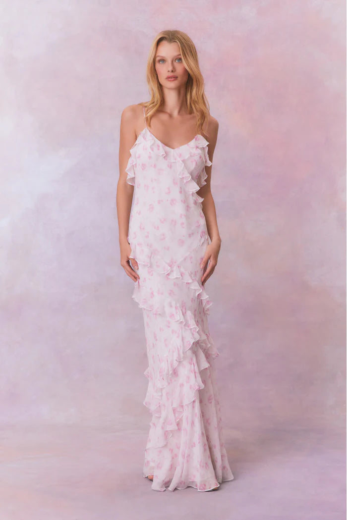 Designed with elegance and movement in mind, the Rialto Maxi Dress in Sterling Dust captivates with its chiffon fabric and cascading asymmetrical ruffles that flow from neckline to hem. Its slightly fitted silhouette enhances your figure with subtle allure, while a discreet side seam zipper ensures a seamless fit. Perfect for dancing or any refined occasion, this dress combines comfort with sophisticated style effortlessly.