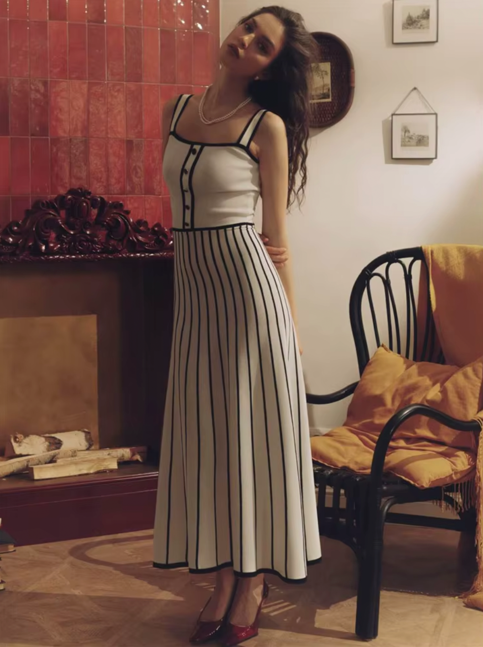 Elevate your evening with the Camille Midi Dress, a refined choice for sophisticated occasions. This slim, strapless design features contrasting stripes that artfully enhance its elegant silhouette. The backless cut adds a subtle allure, while the knit fabric ensures comfort and a flawless fit. Perfect for parties or upscale events, this dress combines modern style with timeless grace.