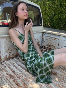 Indulge in luxury with the Juliette Dress. Crafted from French light luxury silk, this vintage green plaid dress features a unique diagonal cut and a large swing fishtail skirt for a stunning silhouette. With its long straps, it can be styled in multiple ways to suit your mood and occasion. Elevate your wardrobe with this must-have dress.