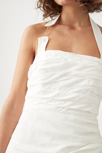 Elevate your elegance with the Mika Draped Split Maxi Dress in Ivory by Aje. Crafted from midweight ruched linen, this fully lined dress features a sophisticated asymmetrical hem that flows gracefully. The exposed back zipper adds a modern edge, while the gold-tone and faux pearl accents on the halterneck strap enhance its refined charm. Perfect for making a timeless statement at any upscale event.
