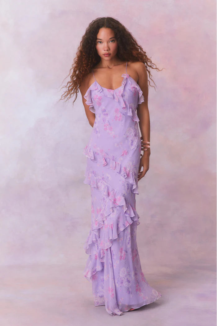 Designed with elegance and movement in mind, the Rialto Maxi Dress in Hibiscus captivates with its chiffon fabric and cascading asymmetrical ruffles that flow from neckline to hem. Its slightly fitted silhouette enhances your figure with subtle allure, while a discreet side seam zipper ensures a seamless fit. Perfect for dancing or any refined occasion, this dress combines comfort with sophisticated style effortlessly.