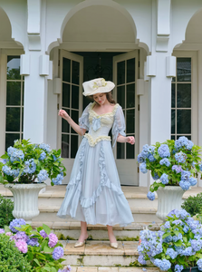 Introducing the Elora Dress - a vintage-inspired, slimming maxi dress in a sophisticated fishbone blue. With delicate lace accents and a seductive V-neck, this dress is perfect for summer parties and birthdays. Channel elegance and sexiness with every step in this exclusive piece.