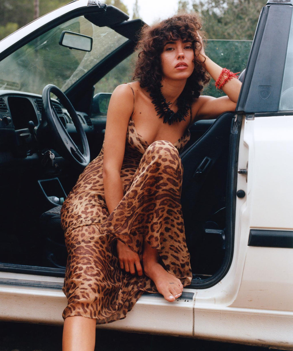 Indulge in the daring and captivating Valentina Maxi Dress. This iconic piece exudes the untamed energy and rebellious nature of Rat & Boa's brand. With a fierce and alluring leopard print, it is perfect for those who embrace their wild side. Make a statement in the Valentina dress.