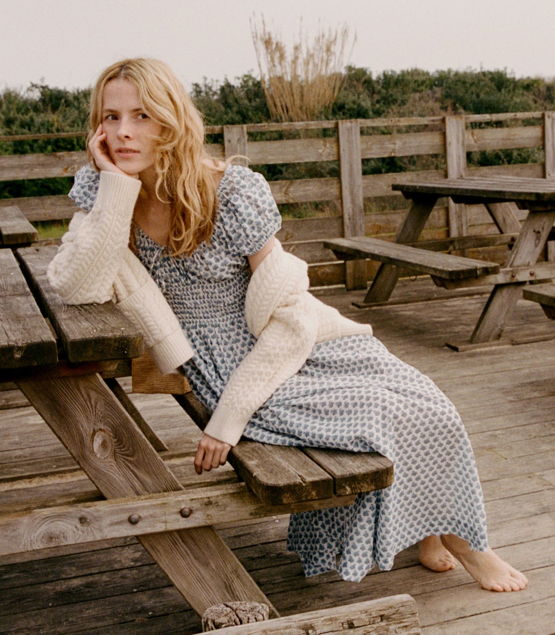 Crafted from 100% organic cotton poplin, the Quinn Dress in Dahlia Ditsy by DOEN offers refined comfort with a scoop neckline accented by an adjustable tie and an elegant keyhole detail, creating a graceful silhouette perfect for any occasion.