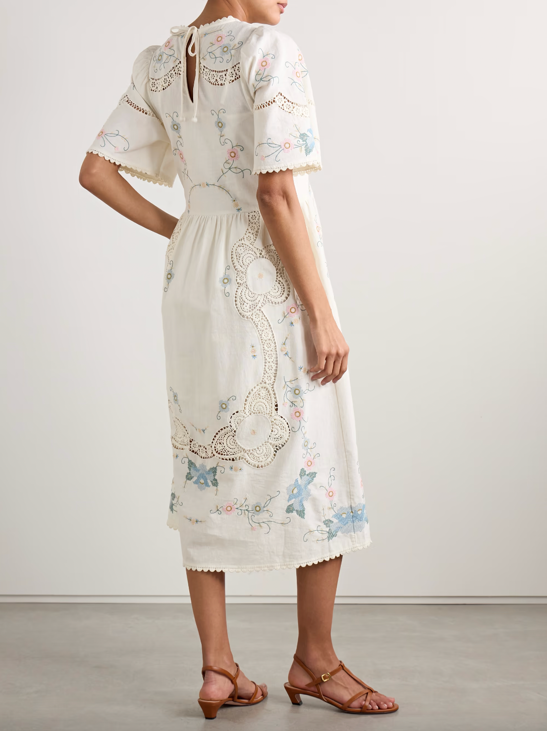 Crafted from a refined cotton and linen blend, the Vesna Linen Dress by SEA features delicate broderie anglaise trim and intricate embroidery, highlighting expert craftsmanship. Its midi length offers timeless elegance, while breathable fabrics ensure comfort in warmer weather. This dress effortlessly balances classic design with modern appeal, making it a versatile addition to a sophisticated wardrobe.