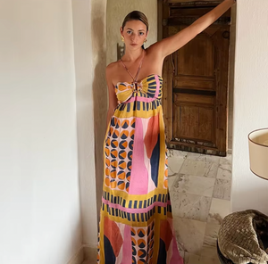 Elevate your wardrobe with the Molly Maxi Dress. This iconic strapless design from Maison BA&SH features a backless silhouette with a delicate spaghetti tie. The draped effect at the chest and gathered skirt add an elegant touch. Perfect for a bohemian chic look.