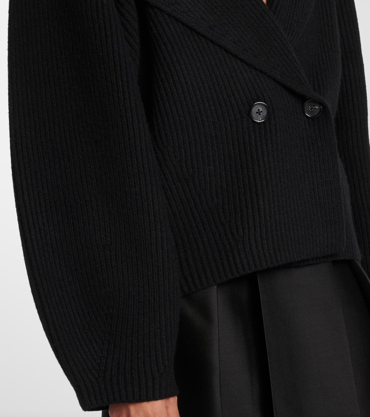 This Toteme wool-blend cardigan offers refined warmth and timeless style. Crafted from a premium wool blend, it provides softness and insulation perfect for layering in cooler weather. Its clean lines and subtle detailing ensure a versatile piece suitable for both casual and more polished looks, making it a valuable addition to any discerning wardrobe.