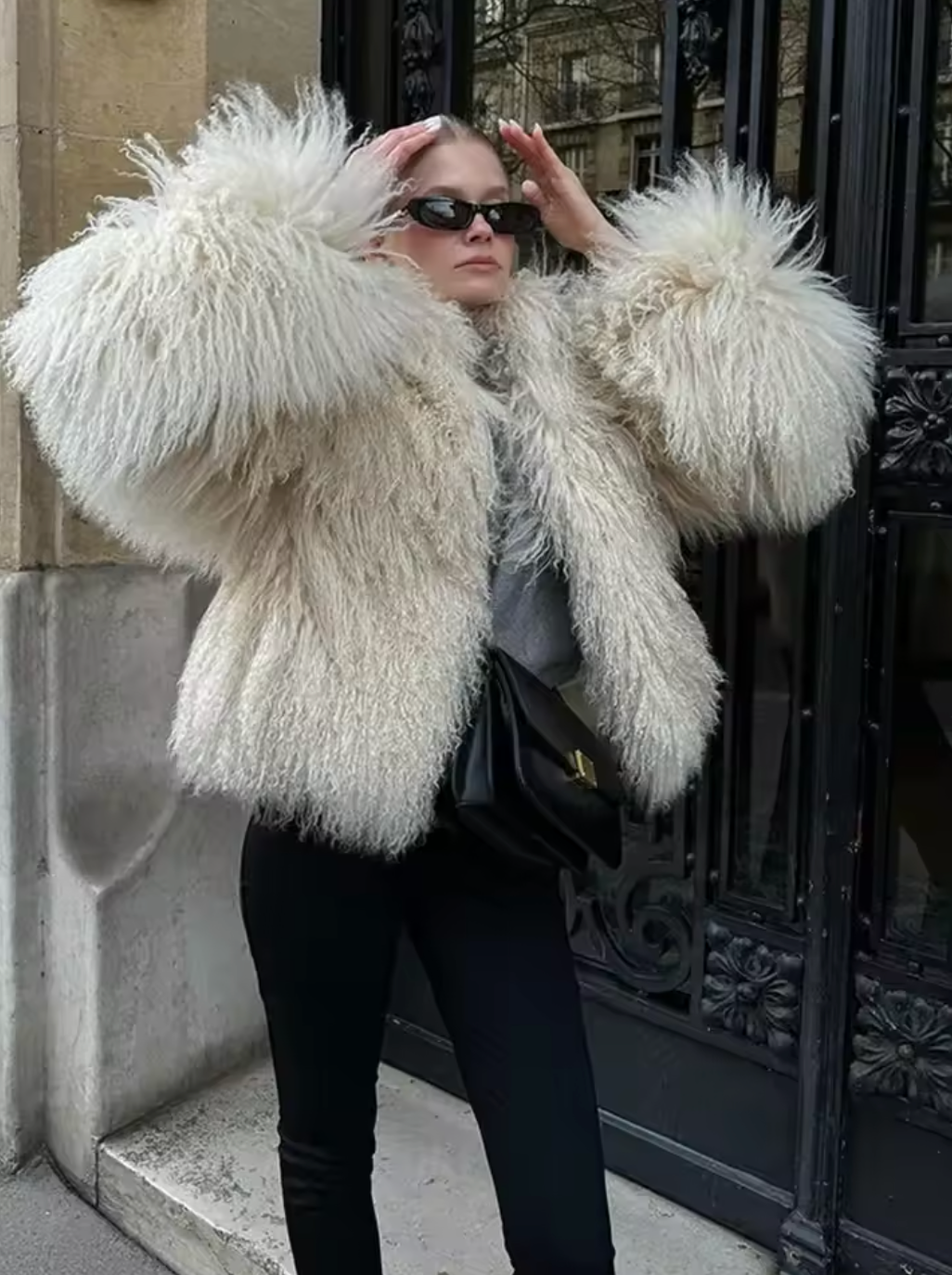 The Georgina Coat is a sophisticated winter essential crafted from thick, solid-color faux fur to provide exceptional warmth and style. Featuring a flattering round neck and long sleeves, this short jacket combines cozy comfort with high street elegance. Perfect for layering over any outfit, it promises durability and a polished look, making it a versatile choice for the colder months. 