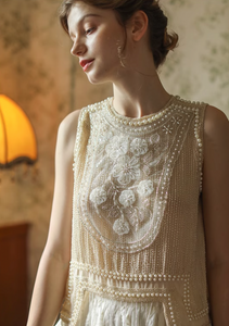 Introducing the Keira Blouse, the perfect choice for any fashionable woman looking to elevate her style. This elegant top features delicate handmade beading and a loose fit for a chic Mori Kei aesthetic. Exude effortless charm and stand out from the crowd with the Keira Blouse.