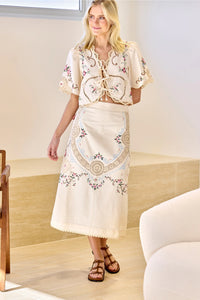 Indulge your senses in the Edwina Embroidery Skirt by SEA. With its intricate cross stitch embroidery and crochet trim detailing, this skirt exudes sophistication and luxury. Made with a blend of cotton and linen, and featuring a slim fit design, it is both stylish and comfortable. Complete the look with the invisible back zipper and a 100% cotton lining for a flawless finish.