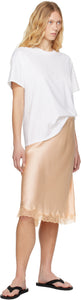 The White Nadina Oversized Short-Sleeve Top by The Row is expertly crafted from soft white cotton, balancing comfort with sophisticated design. Its classic crew neckline and short sleeves complement the clean, straight hem, while the oversized fit provides relaxed ease enhanced by subtle ribbed detailing for added texture and structure. This versatile tee offers a refined, effortless aesthetic, perfect for layering or standalone wear.