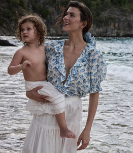 The Henri top in Bleu Rosier Floral offers a refined yet approachable style, crafted from soft fabric adorned with a delicate blue floral pattern. Its subtle ruffle detail and V-neckline enhance the rustic charm while the gently fitted silhouette flatters the figure. Pair it effortlessly with blue denim for versatile looks that transition seamlessly from casual daywear to polished evening ensembles with the right footwear choice.
