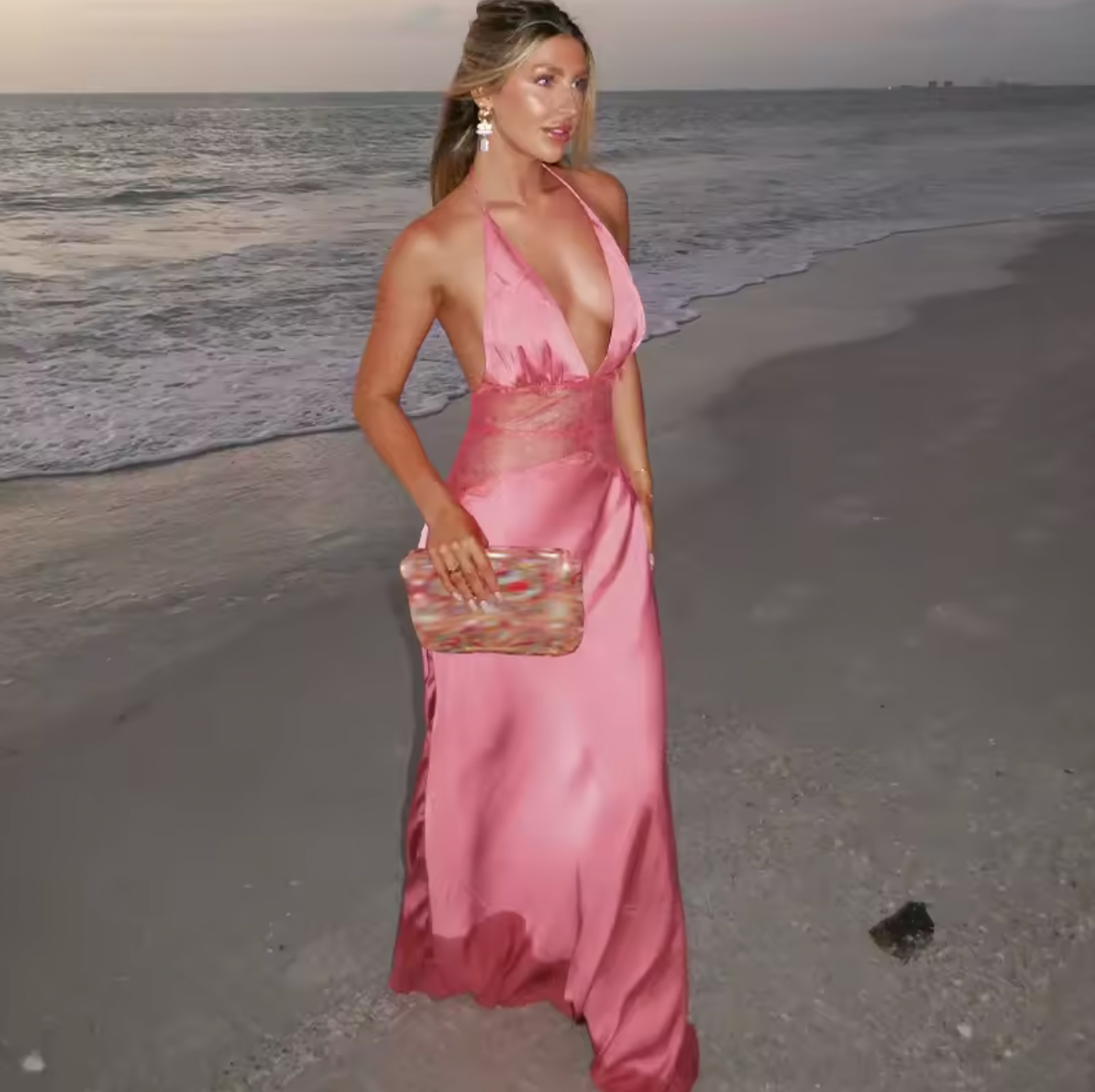 The Dinah Satin Dress offers a refined blend of elegance and allure with its halter tie V-neckline and softly gathered bust. Crafted with a sheer lace body that gracefully follows your silhouette, it features a dramatic low back and a maxi length for timeless sophistication. Partially lined and equipped with an invisible zip, this dress ensures a flawless fit and subtle coverage, perfect for making a confident statement at any special occasion.