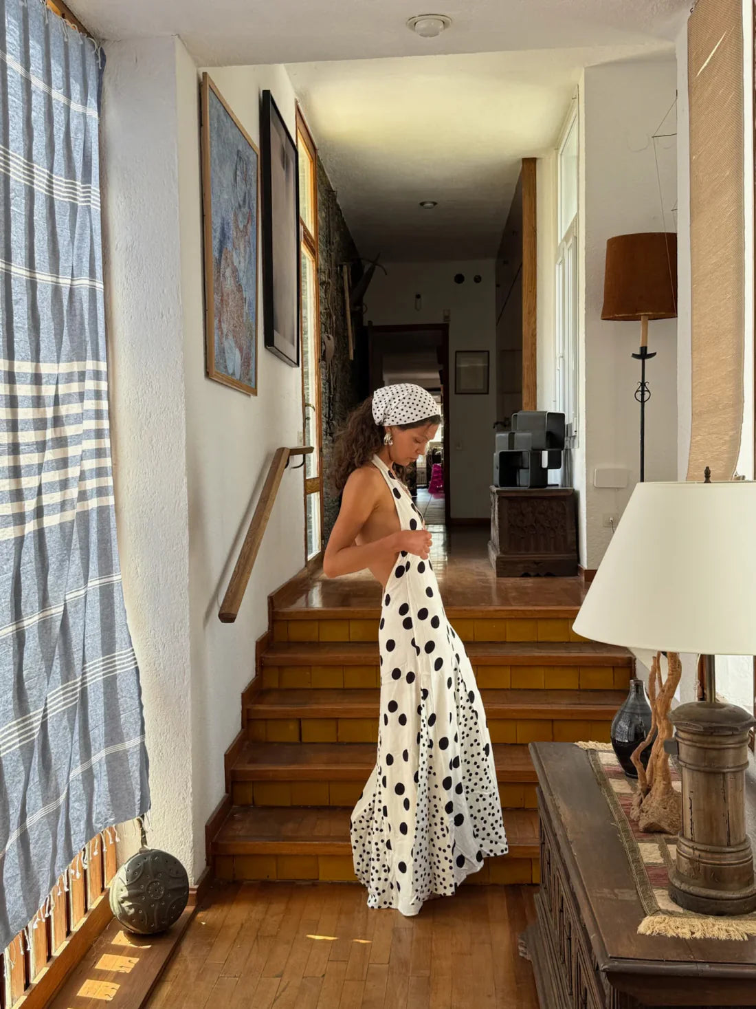 The Maria Dress offers a refined summer silhouette with its sleeveless halter design and delicate dot print. Featuring a lace-up back that creates an elegant backless effect, this maxi dress balances allure with comfort. Lightweight, flowing fabric ensures ease of movement, making it an ideal choice for warm evenings or vacation settings. Its thoughtful construction combines style and practicality, guaranteeing a standout presence in any occasion.