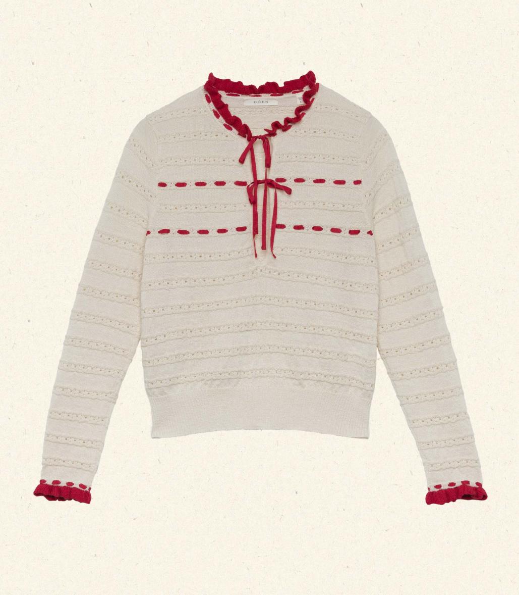 Inspired by 1940s knitwear, the Cordelie Top in Moonstone features a luxurious blend of 80% baby alpaca and 20% silk for exceptional softness and warmth. Lightweight yet insulating, this layerable piece offers delicate sophistication with silk grosgrain ribbons that tie elegantly at the neck. Crafted in Peru with sheer opaque fabric, it combines refined heritage style with modern comfort for versatile wear.