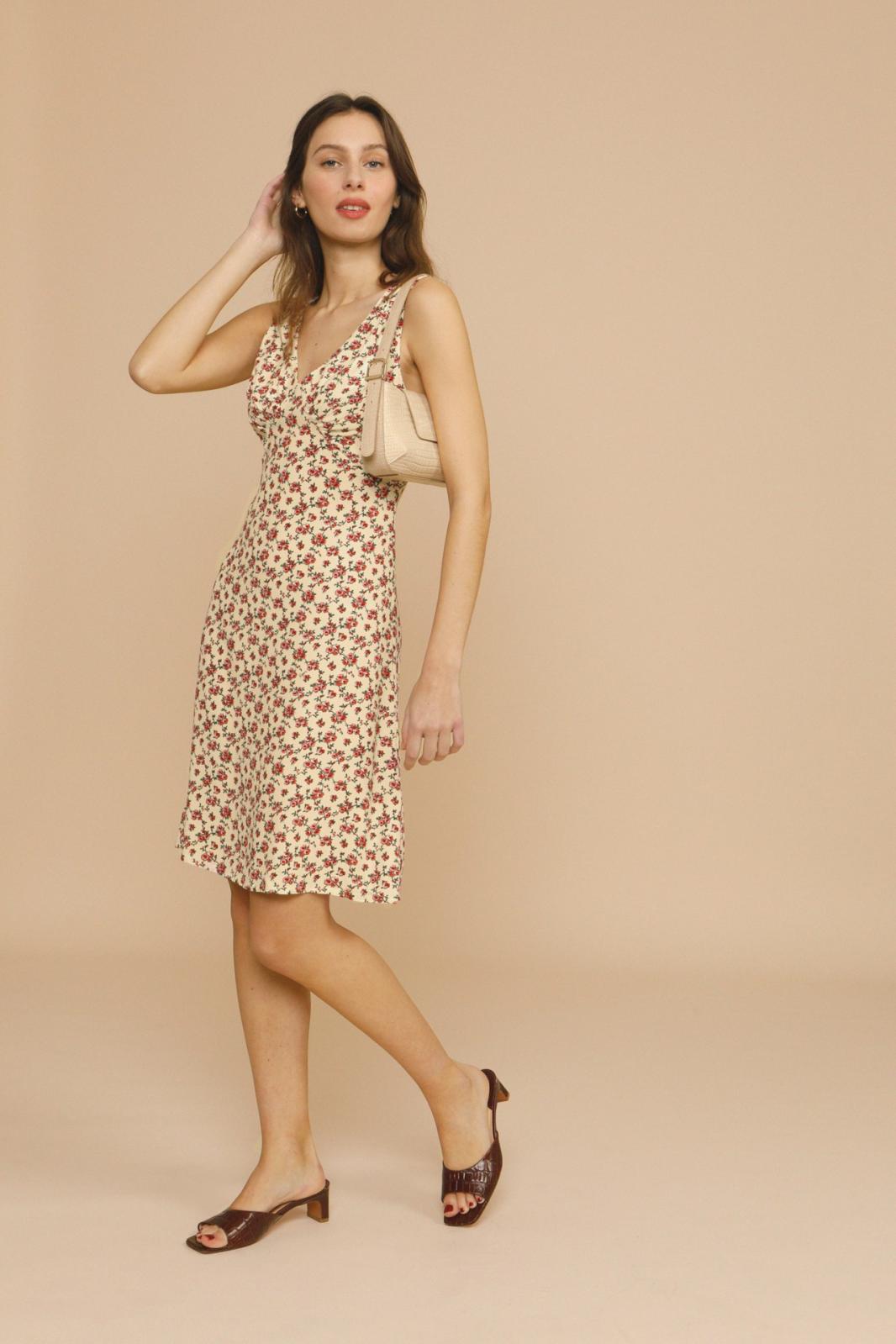 The Silvia Dress by Rouje is a sophisticated midi-length design featuring strategic chest cutouts and a flattering V-neckline at both front and back. Tailored for a precise fit, it secures with a discreet zip and hook fastenings at the back, combining elegance with ease of wear. Perfect for those seeking a refined yet contemporary silhouette.