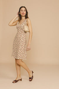 The Silvia Dress by Rouje is a sophisticated midi-length design featuring strategic chest cutouts and a flattering V-neckline at both front and back. Tailored for a precise fit, it secures with a discreet zip and hook fastenings at the back, combining elegance with ease of wear. Perfect for those seeking a refined yet contemporary silhouette.