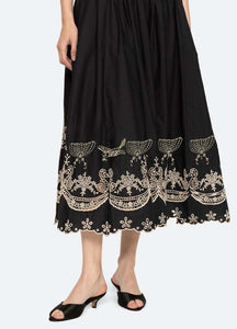 The Kingsley embroidered tank dress by SEA NY showcases intricate embroidery throughout its design, offering a refined and elegant appeal. It features a high neckline that adds a sophisticated touch, complemented by a delicate back bow tie for adjustable fit and added charm. The scalloped hemline enhances the dress's feminine silhouette, making it an exceptional choice for those seeking a polished yet distinctive look.