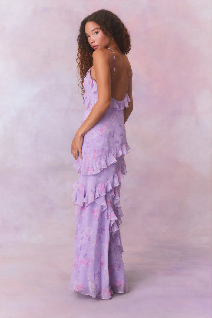 Designed with elegance and movement in mind, the Rialto Maxi Dress in Hibiscus captivates with its chiffon fabric and cascading asymmetrical ruffles that flow from neckline to hem. Its slightly fitted silhouette enhances your figure with subtle allure, while a discreet side seam zipper ensures a seamless fit. Perfect for dancing or any refined occasion, this dress combines comfort with sophisticated style effortlessly.