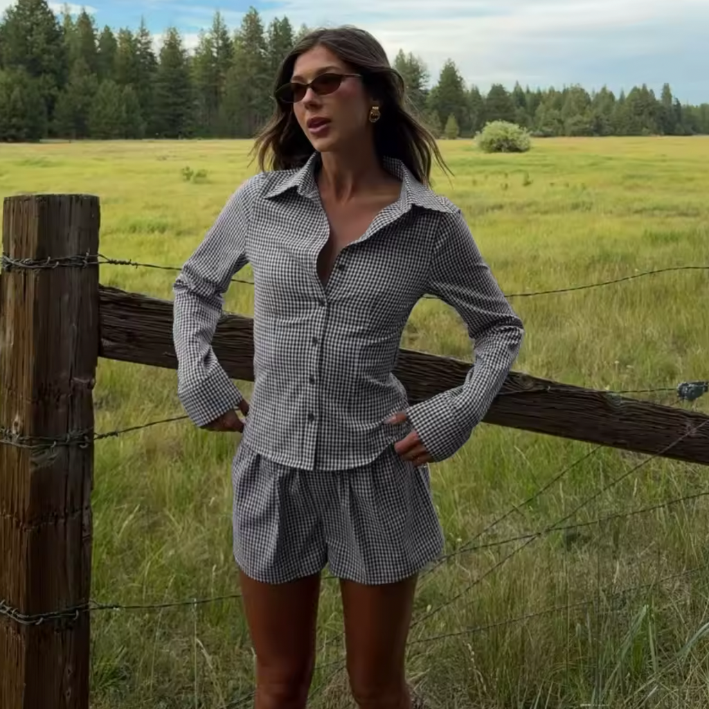 The Elodie Set combines effortless style with contemporary edge. This curated two-piece features a casual printed shirt paired with slim-fitting shorts, delivering a cohesive look rooted in retro streetwear aesthetics. Perfect for the modern commuter, the set balances vintage-inspired design with practical everyday wearability. The printed top adds visual interest while the tailored shorts provide a flattering silhouette.