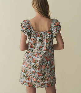 The Julie Cotton Mini Dress in Calico Garden by Doen combines lightweight cotton fabric with a delicate floral print for breathable comfort and timeless style. Its mini length and tailored fit offer a flattering silhouette suitable for warm days and casual outings, while the soft material ensures ease of movement. Ideal for those seeking an effortless yet refined look, this dress blends classic design with everyday practicality.