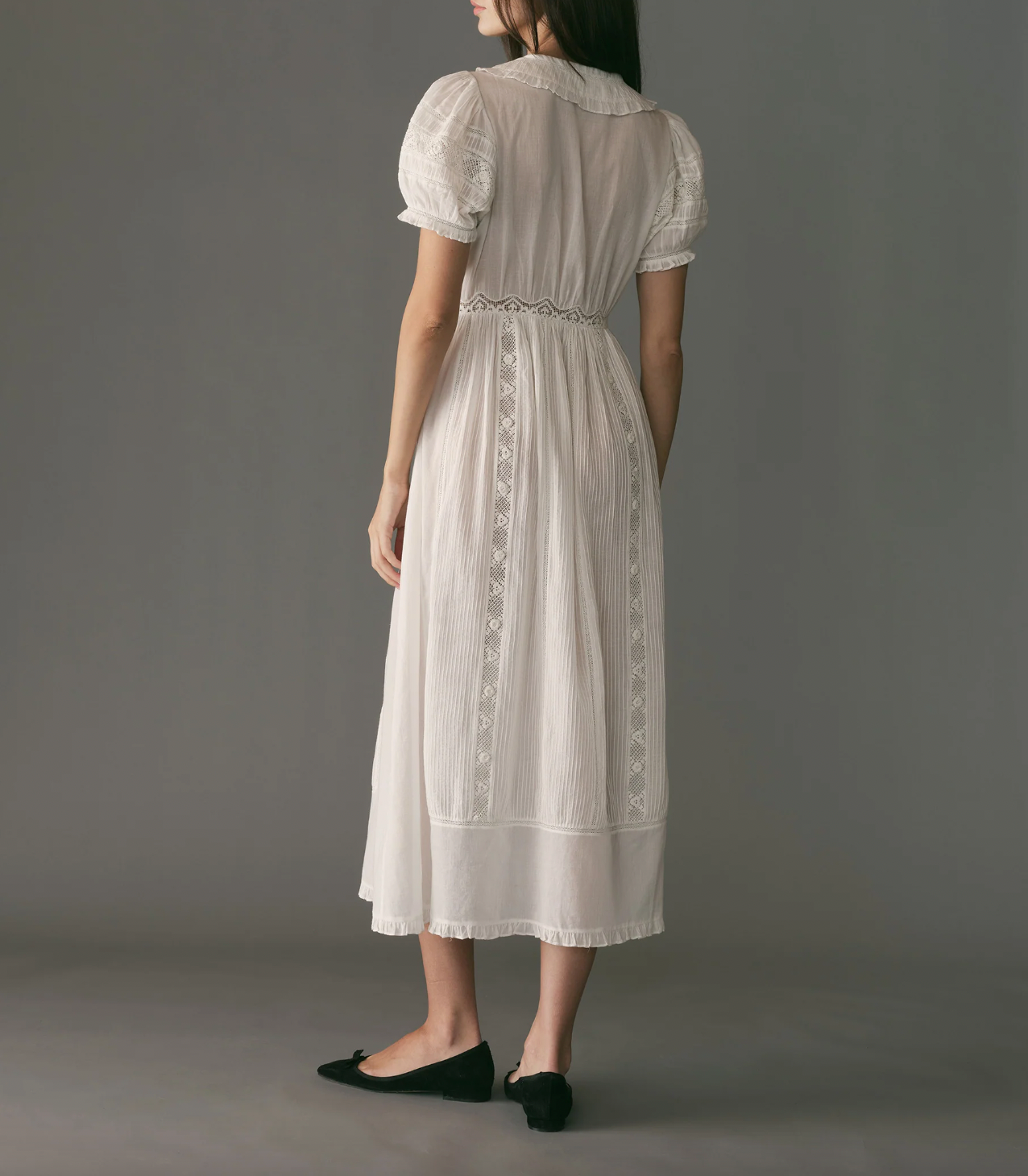 Indulge in timeless elegance with our Phoebe Lace Dress. Made from the softest organic cotton voile, it features delicate pintucks, inset lace, and a ruffled Peter Pan collar for a Victorian-inspired look. The fitted waist and mother-of-pearl buttons add a touch of sophistication, making it perfect for any occasion.