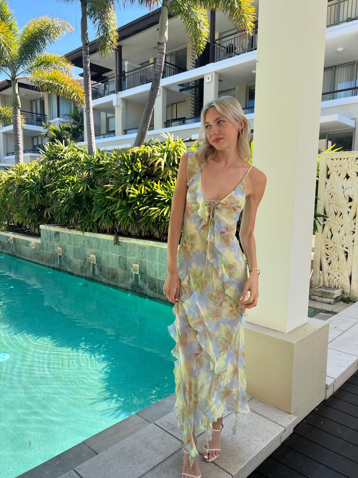 Crafted from lustrous silk print fabric and cut on the bias, the Courtney Frill Maxi Dress by Bec + Bridge embodies sophisticated ease. This statement piece showcases a plunging V-neckline, asymmetrical raw-cut shoulder detail, and artfully placed raw-cut ruffles that create movement and visual interest. The lace-up front closure and open V-back add architectural intrigue, making this an ideal choice for those seeking refined elegance with contemporary edge.