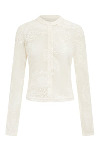 Elevate your wardrobe with the Dom Set by With Jean, expertly combining refined craftsmanship and elegant design. The Dom Top is a long-sleeve cardigan featuring a button-up front, a polished neckline collar, and delicate scalloped trim, enhanced by custom hand-drawn crochet lace for a sophisticated finish. Complementing the top, the Dom Shorts offer comfort with a fully lined interior and an elasticated waistband, adorned entirely with the same intricate crochet lace. 