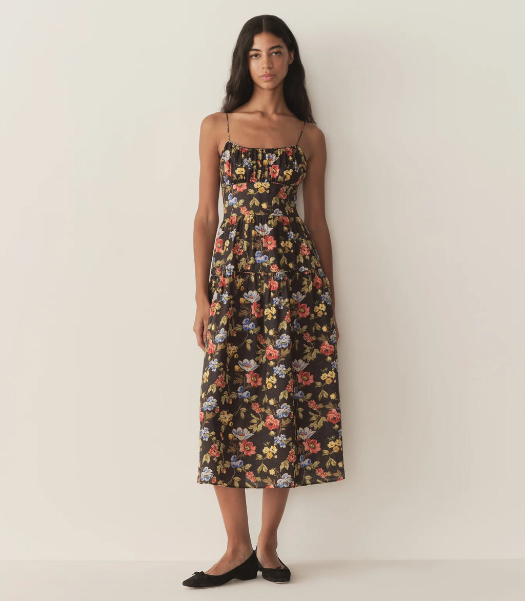 Crafted from lightweight ramie fabric adorned with a delicate 1930s French block print, the Benoit Dress offers a refined silhouette for spring. It features a soft sweetheart neckline paired with ultra-skinny spaghetti straps, lending a subtle elegance. The fitted bodice with an invisible side zipper ensures a sleek fit, while the ankle-grazing A-line skirt provides graceful movement and timeless appeal.