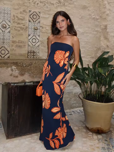 Embrace elegance with the Orfila Manila Maxi Dress, featuring a strapless floral print that captures the essence of summer sophistication. Its sleeveless, backless design paired with a flowing silhouette offers a flattering, graceful fit perfect for beach parties or evening events. Complete with a coordinating scarf, this dress combines comfort and style for unforgettable holiday moments.