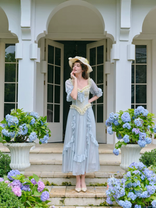 Introducing the Elora Dress - a vintage-inspired, slimming maxi dress in a sophisticated fishbone blue. With delicate lace accents and a seductive V-neck, this dress is perfect for summer parties and birthdays. Channel elegance and sexiness with every step in this exclusive piece.
