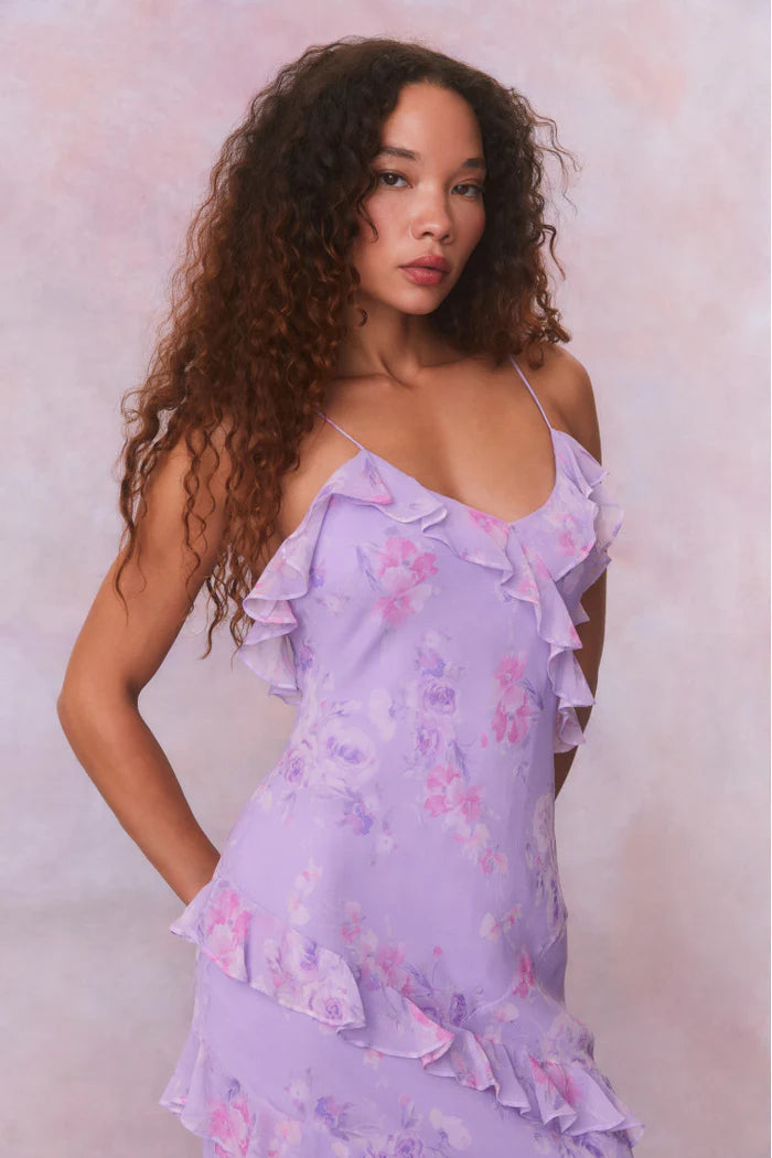 Designed with elegance and movement in mind, the Rialto Maxi Dress in Hibiscus captivates with its chiffon fabric and cascading asymmetrical ruffles that flow from neckline to hem. Its slightly fitted silhouette enhances your figure with subtle allure, while a discreet side seam zipper ensures a seamless fit. Perfect for dancing or any refined occasion, this dress combines comfort with sophisticated style effortlessly.
