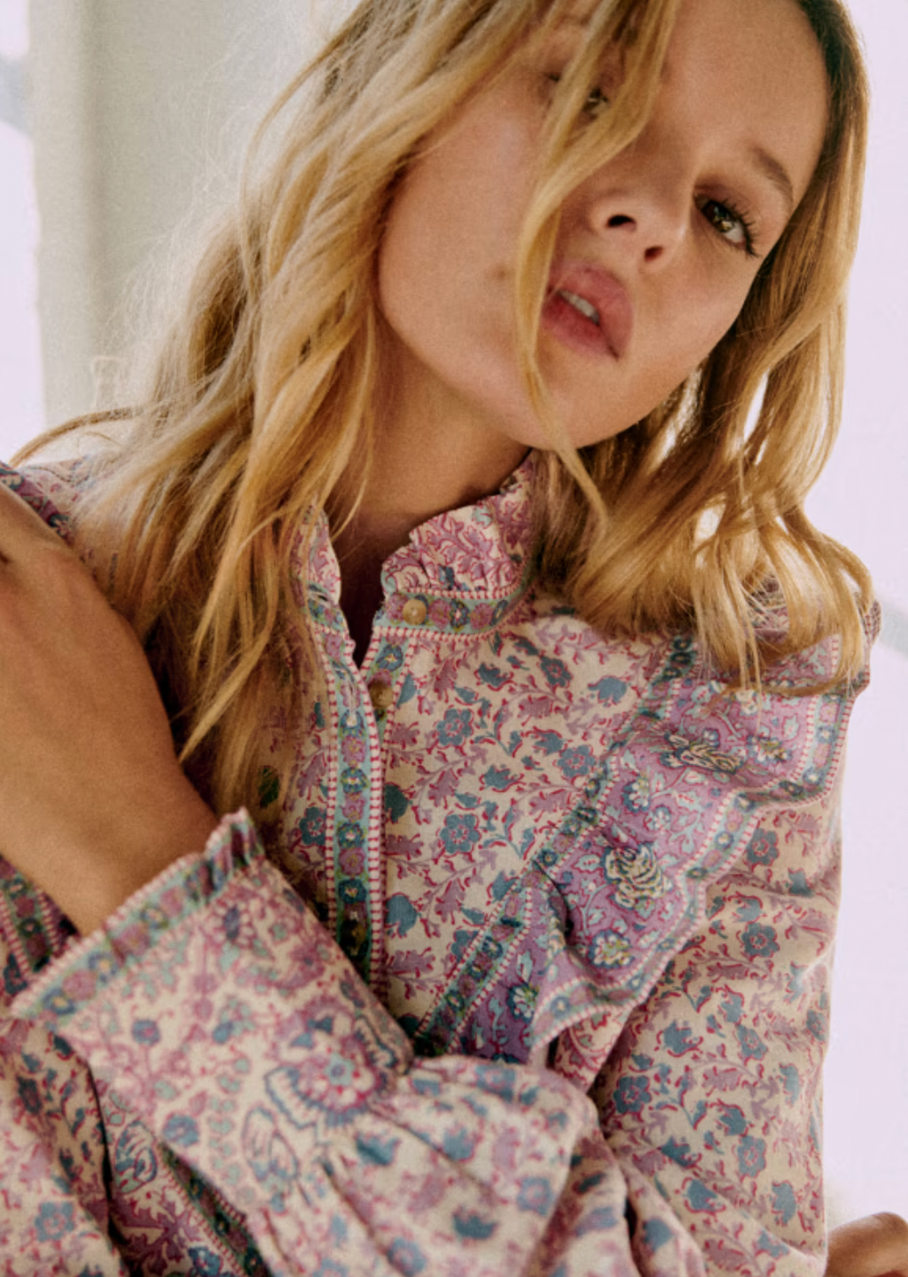 Elevate your wardrobe with the Gala Shirt by Sezane, featuring a gathered high collar that adds refined structure. Delicate ruffles cascade down the front, enhancing its elegant silhouette. The wide sleeves offer a modern, voluminous shape, expertly tailored with cuffs to provide a polished finish. This shirt combines classic detailing with contemporary design for a sophisticated, standout look.