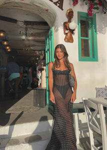 Indulge your inner siren with the Gisele Dress from Rat and Boa. Inspired by 90s fashion, this slip dress is made from sheer polka dot silk, hugging your curves in all the right places. The cowl neck and open back add irresistible charm. Channel your inner goddess in this must-have piece.