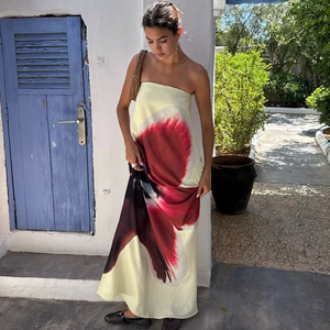 Discover the duality of femininity and toughness with the Antheia Maxi Dress. Featuring a sleek, loose silhouette and a tough leather belt strap, this dress is perfect for making a statement. The vibrant colors of the orchid print add a touch of sexy to this edgy piece.