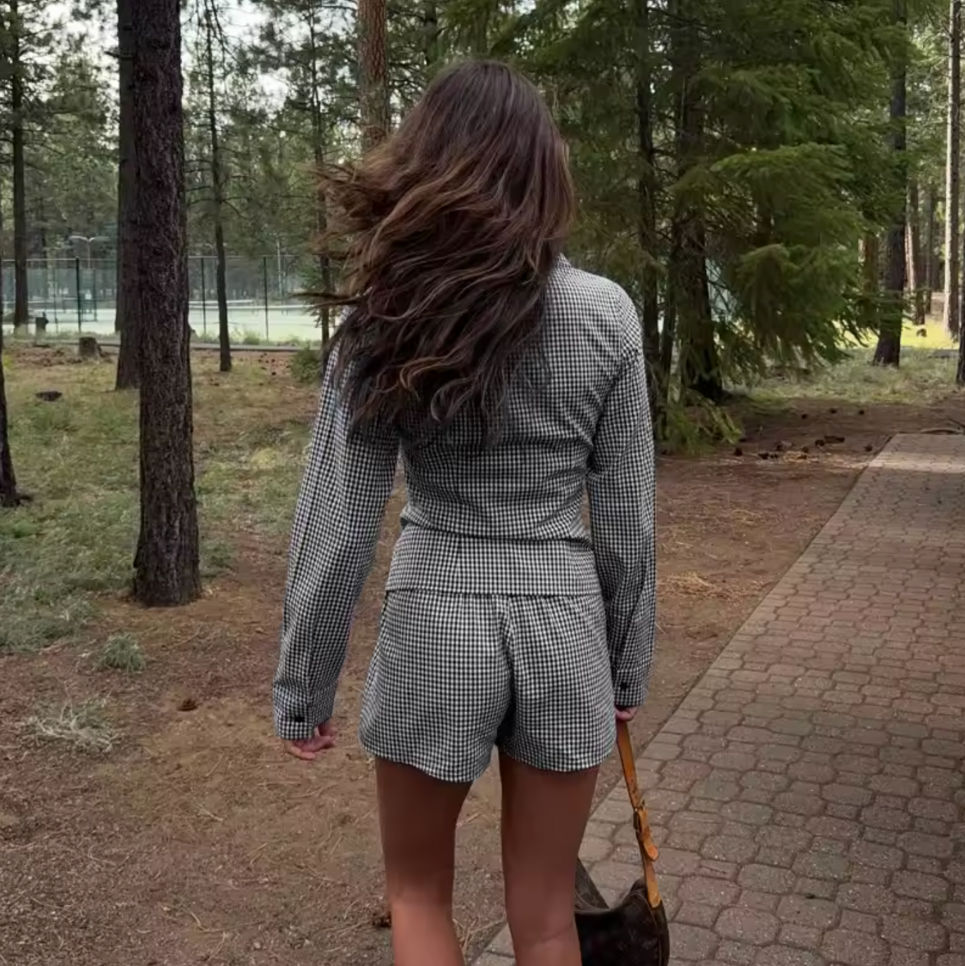 The Elodie Set combines effortless style with contemporary edge. This curated two-piece features a casual printed shirt paired with slim-fitting shorts, delivering a cohesive look rooted in retro streetwear aesthetics. Perfect for the modern commuter, the set balances vintage-inspired design with practical everyday wearability. The printed top adds visual interest while the tailored shorts provide a flattering silhouette.