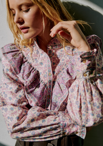 Elevate your wardrobe with the Gala Shirt by Sezane, featuring a gathered high collar that adds refined structure. Delicate ruffles cascade down the front, enhancing its elegant silhouette. The wide sleeves offer a modern, voluminous shape, expertly tailored with cuffs to provide a polished finish. This shirt combines classic detailing with contemporary design for a sophisticated, standout look.