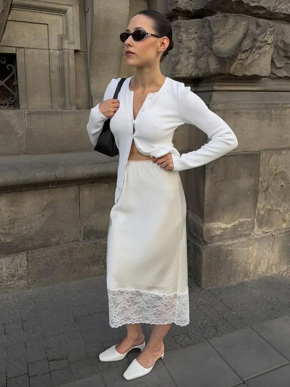 Elevate your wardrobe with the Margot Lace Skirt, an elegant satin piece designed for the modern professional woman. Featuring a high waist and graceful lace splice detail, this long skirt combines sophistication with comfort, ideal for summer wear. Its refined silhouette enhances your figure while maintaining a polished look suitable for any formal or business setting. The breathable satin fabric ensures all-day comfort, making it a versatile addition to your seasonal collection.