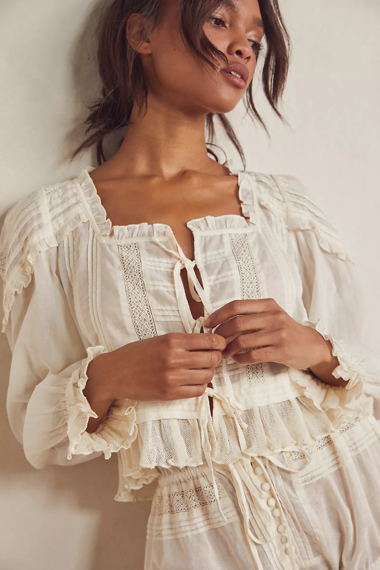 Embrace timeless elegance with the Florence Bed Jacket Set, designed for sophisticated comfort. The structured bed jacket features front tie closures, pleated details, banded trumpet sleeves, and delicate embroidery, offering a refined vintage appeal. Coordinating button-front shorts include a drawstring waist, ruffle trimming, pleated accents, and an embroidered curved hem, ensuring an effortless, flattering fit. This set blends classic style with ease, perfect for lounging with grace and poise.