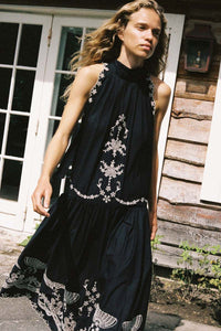 The Kingsley embroidered tank dress by SEA NY showcases intricate embroidery throughout its design, offering a refined and elegant appeal. It features a high neckline that adds a sophisticated touch, complemented by a delicate back bow tie for adjustable fit and added charm. The scalloped hemline enhances the dress's feminine silhouette, making it an exceptional choice for those seeking a polished yet distinctive look.