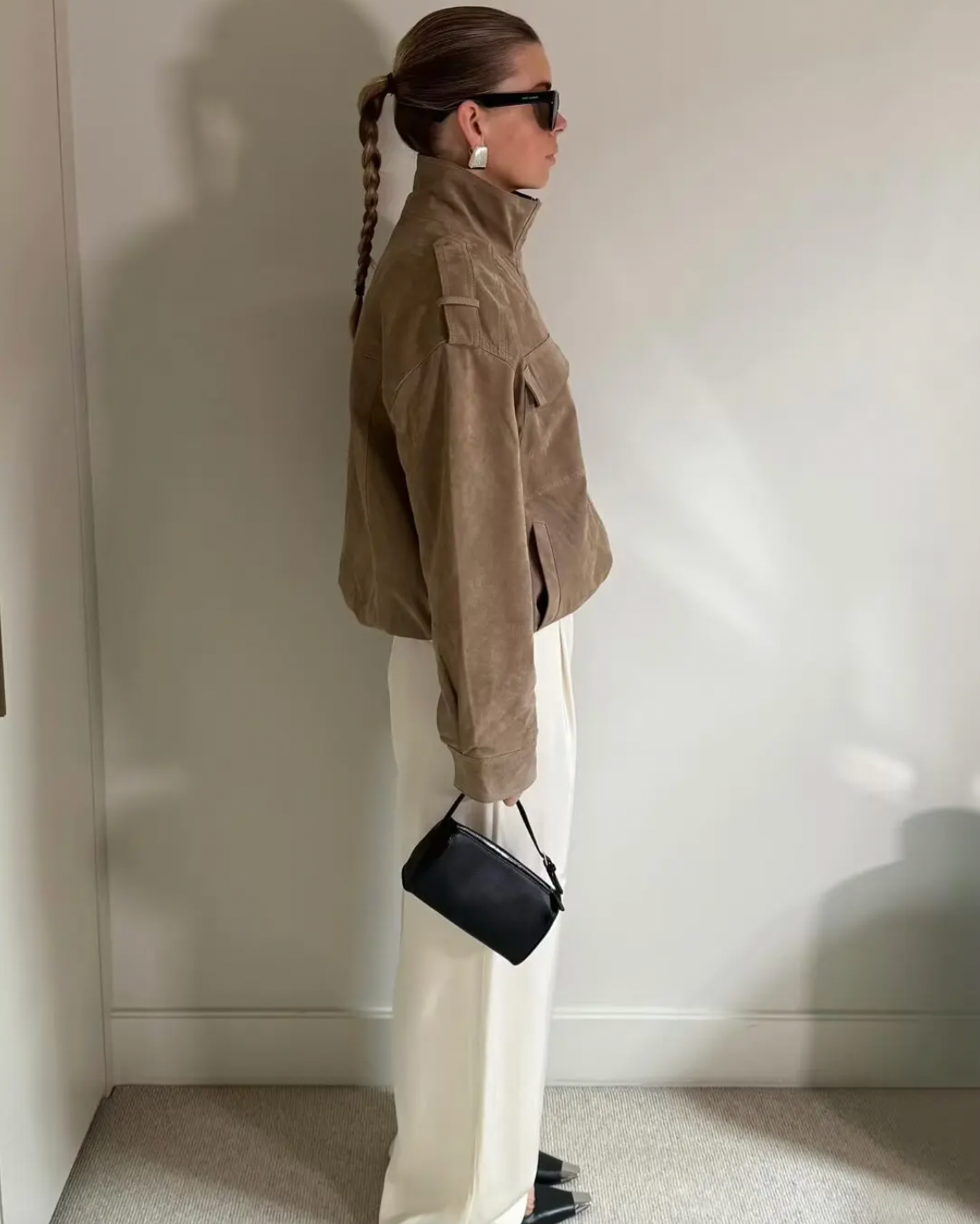 This Suede Jacket combines timeless sophistication with practical design. Crafted from soft suede leather, it features a high collar that provides extra warmth and a refined look. Long cuffed sleeves with shoulder tabs enhance its rugged appeal, while front and chest flap pockets offer convenient storage without sacrificing style. 