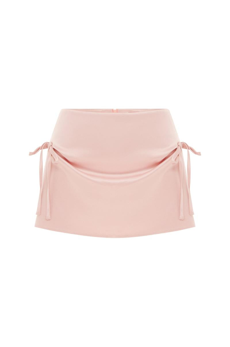 Discover effortless style with the Serena Mini Skirt by With Jean. This low rise, mini length skirt is designed to sit comfortably on your hips, while the back zip closure provides a seamless finish. The cinched bow detailing at the front adds a touch of sophistication to your ensemble. Elevate your look with this luxurious piece.