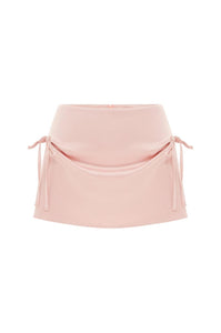 Discover effortless style with the Serena Mini Skirt by With Jean. This low rise, mini length skirt is designed to sit comfortably on your hips, while the back zip closure provides a seamless finish. The cinched bow detailing at the front adds a touch of sophistication to your ensemble. Elevate your look with this luxurious piece.