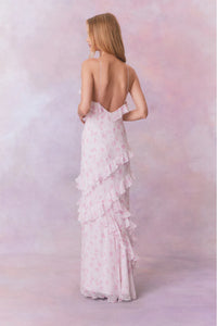 Designed with elegance and movement in mind, the Rialto Maxi Dress in Sterling Dust captivates with its chiffon fabric and cascading asymmetrical ruffles that flow from neckline to hem. Its slightly fitted silhouette enhances your figure with subtle allure, while a discreet side seam zipper ensures a seamless fit. Perfect for dancing or any refined occasion, this dress combines comfort with sophisticated style effortlessly.