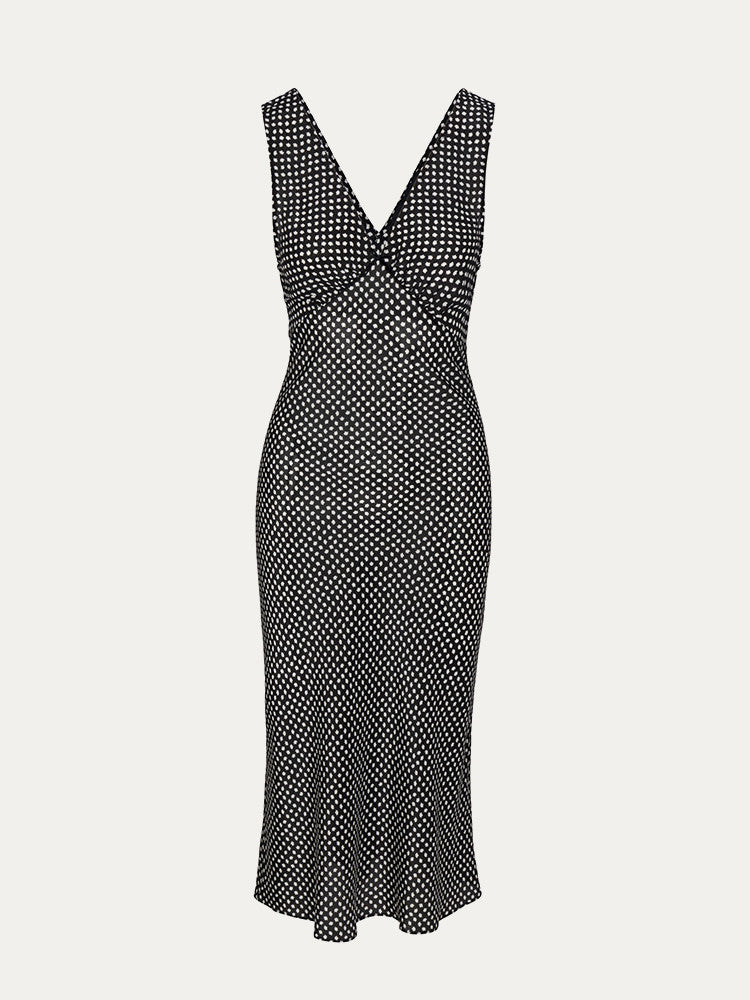 The Stephanie - Paradiso Noir is a silk dress designed for effortless elegance. Its adjustable back tie shapes the waist perfectly, while wide straps offer comfort and bra coverage. The V-neckline subtly enhances the décolletage, and its mid-calf length flatters a range of heights, revealing just the right amount of leg. Versatile for styling, it pairs beautifully with boots for a 90s-inspired look or delicate heels for a more refined finish. A timeless piece that effortlessly elevates your wardrobe.