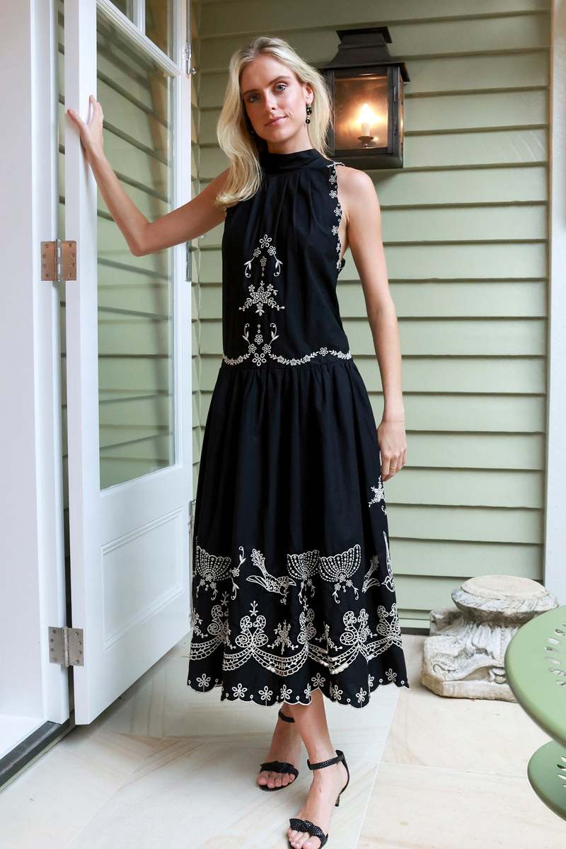 The Kingsley embroidered tank dress by SEA NY showcases intricate embroidery throughout its design, offering a refined and elegant appeal. It features a high neckline that adds a sophisticated touch, complemented by a delicate back bow tie for adjustable fit and added charm. The scalloped hemline enhances the dress's feminine silhouette, making it an exceptional choice for those seeking a polished yet distinctive look.