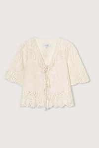 The Gianna Tie Top from Sea New York blends delicate lace detailing with a relaxed fit for effortless elegance. Crafted from 100% cotton with polyester embroidery, it features short flowy sleeves and a front tie closure, delivering both comfort and a romantic silhouette. Ideal for those seeking a refined yet easygoing style.