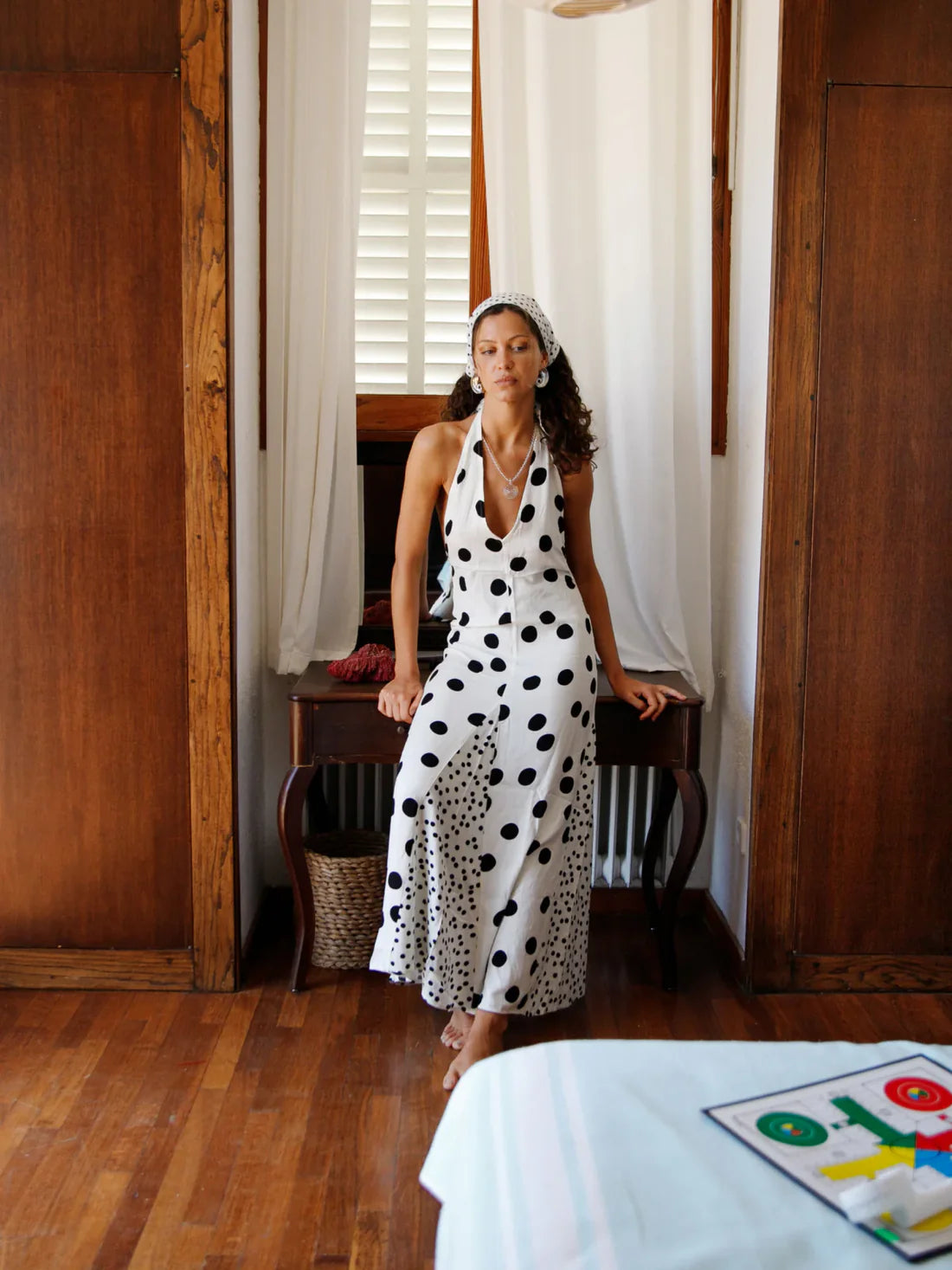 The Maria Dress offers a refined summer silhouette with its sleeveless halter design and delicate dot print. Featuring a lace-up back that creates an elegant backless effect, this maxi dress balances allure with comfort. Lightweight, flowing fabric ensures ease of movement, making it an ideal choice for warm evenings or vacation settings. Its thoughtful construction combines style and practicality, guaranteeing a standout presence in any occasion.